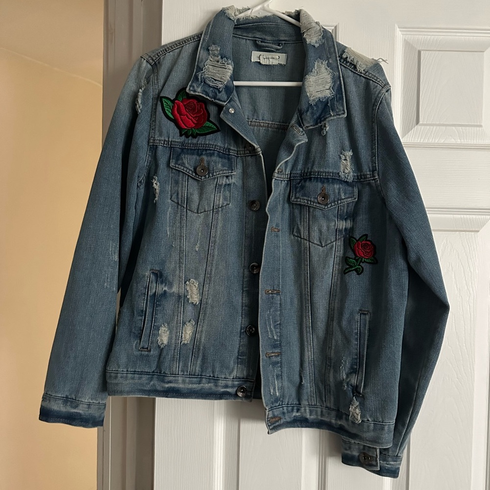 Jean jacket with roses on it